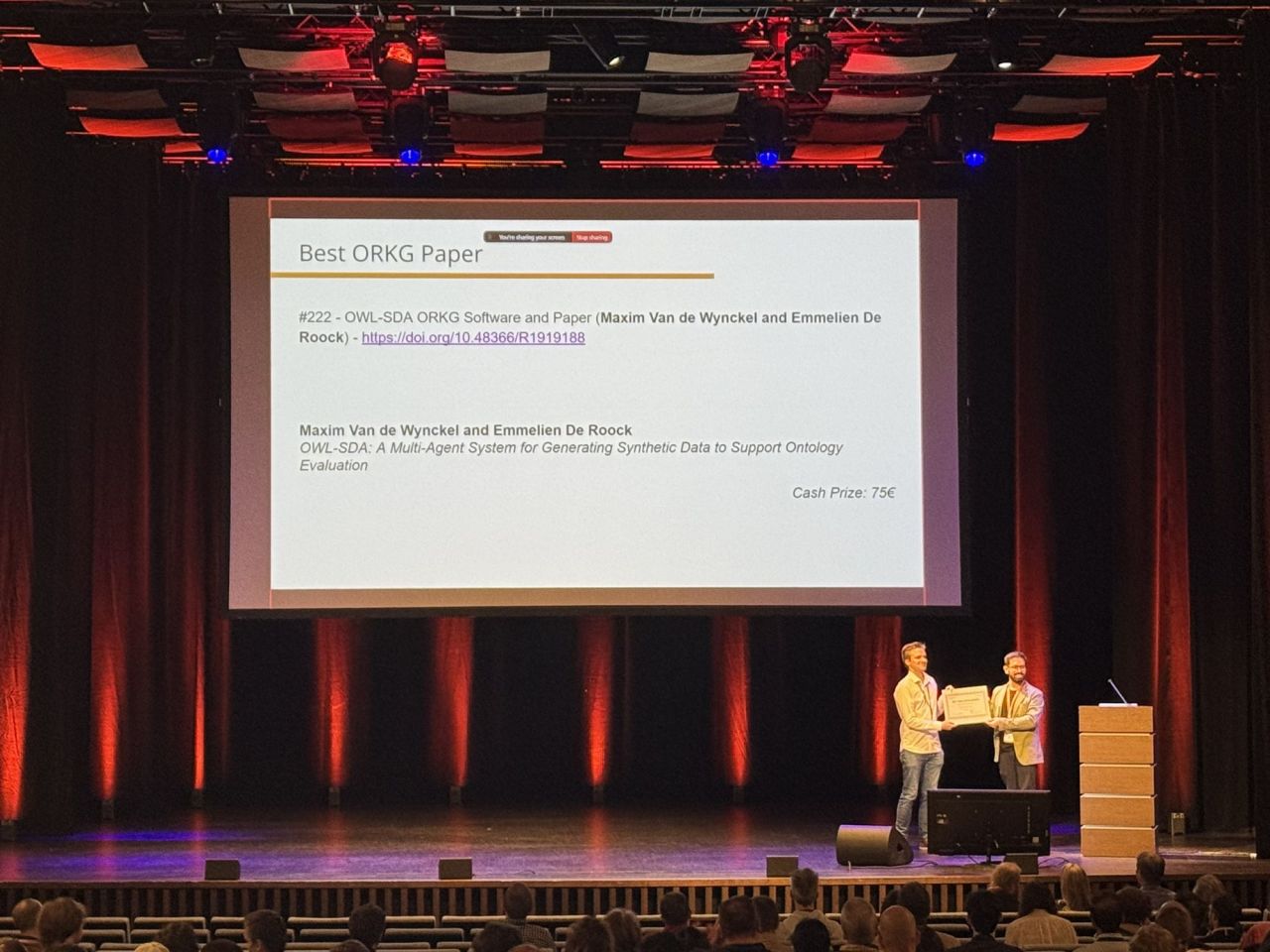 Receiving the Best ORKG Paper Award on stage at SEMANTiCS 2026
